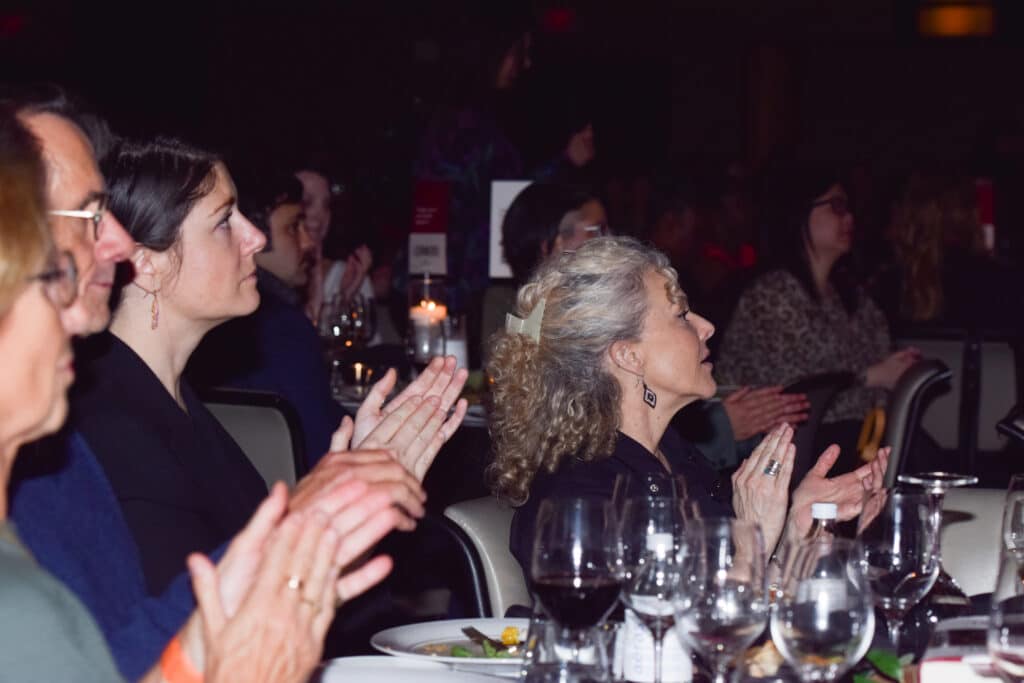 Photo of attendees clapping from the 2025 Evening for Equality event.
