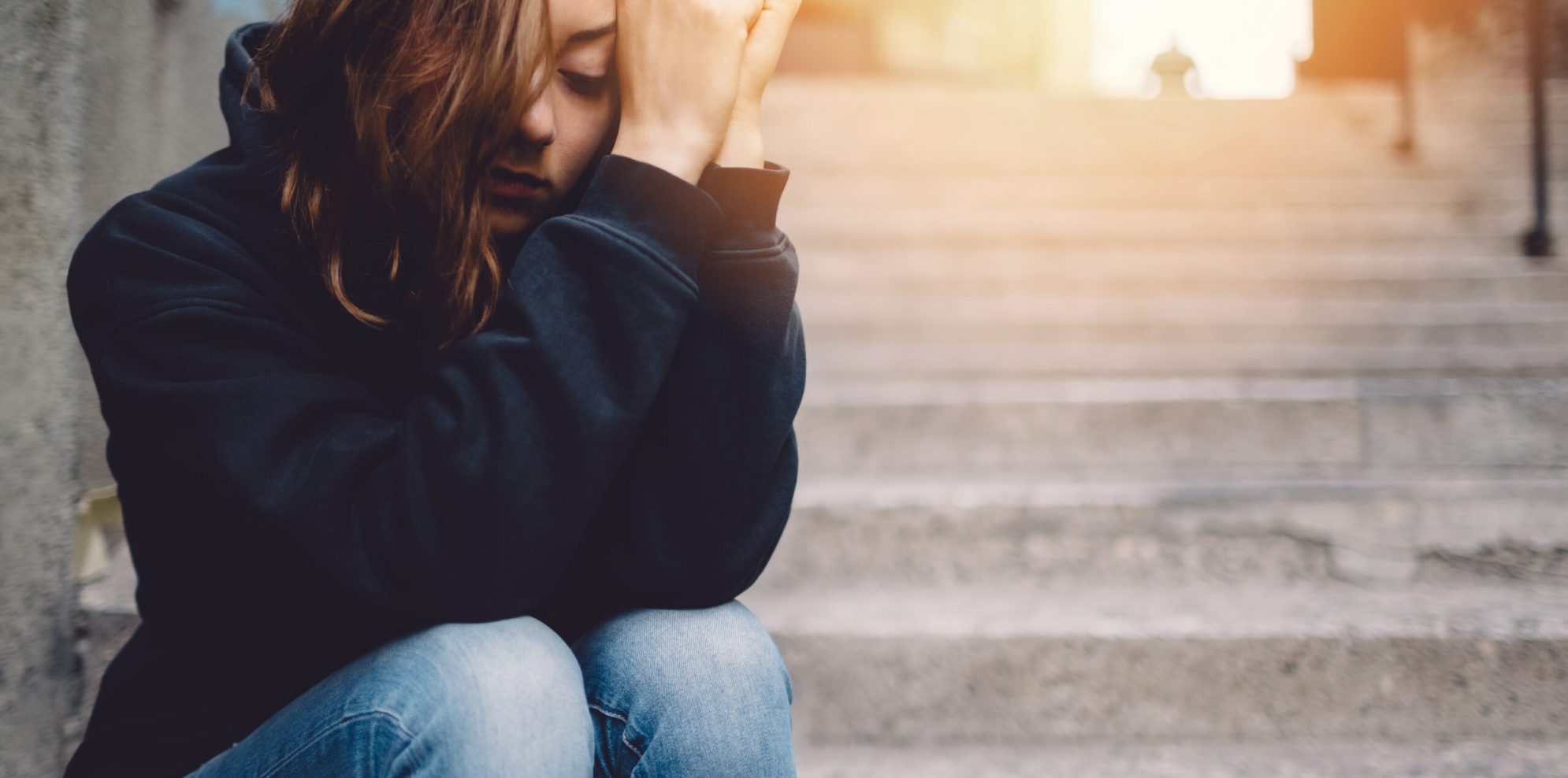 Depressed teenage girl outside